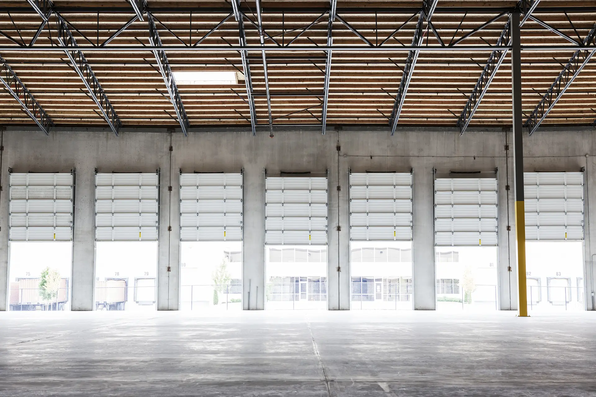 wide shot of several open garage doors